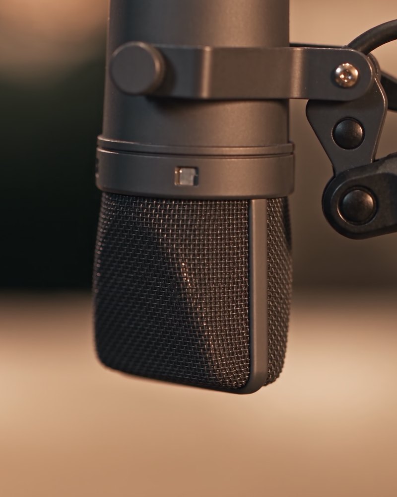 A studio microphone on The Digital Couch set